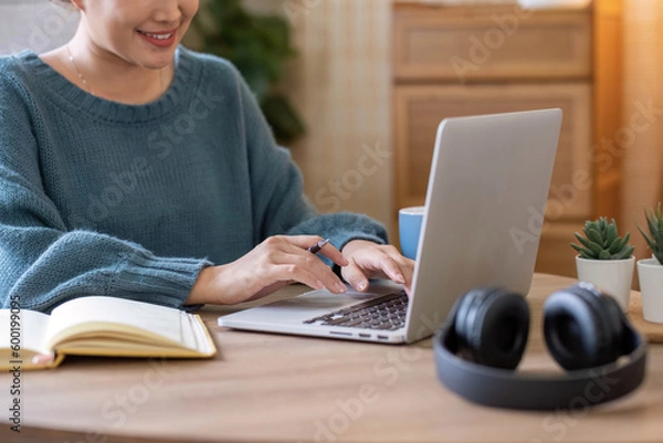 Fototapeta Asian girl student online learning class study online video call zoom teacher, Happy asian girl learn english language online with computer laptop..