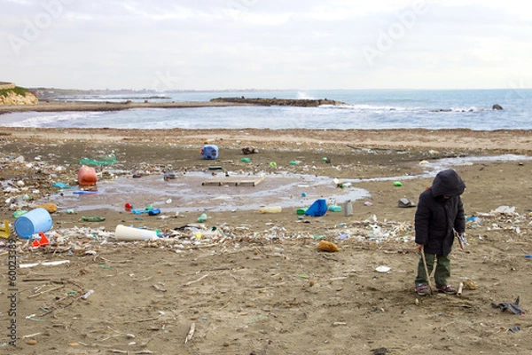 Obraz Young kid not caring about dirt and danger of polluted beach
