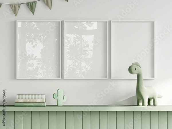 Fototapeta Frame mockup in green kids room interior with dinosaur toy, three white vertical frames mockup, 3d render