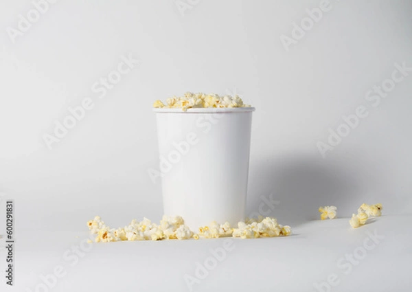 Fototapeta Blank white popcorn bucket mockup isolated, 3d rendering. Clear pop corn pail mockup fastfood front side view. Paper snack bucketful design mock up. 3D illustration.