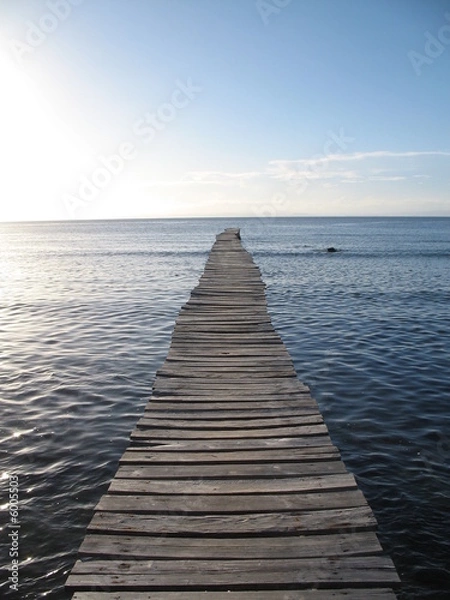 Obraz ponton de bois sur le lagon et ciel bleu en fond