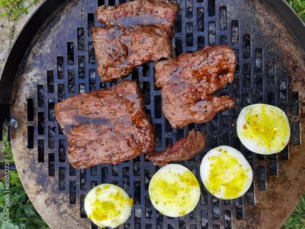 Obraz Beef steak on the grill with smoke and flames