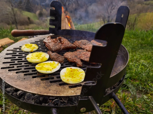 Obraz Beef steak on the grill with smoke and flames