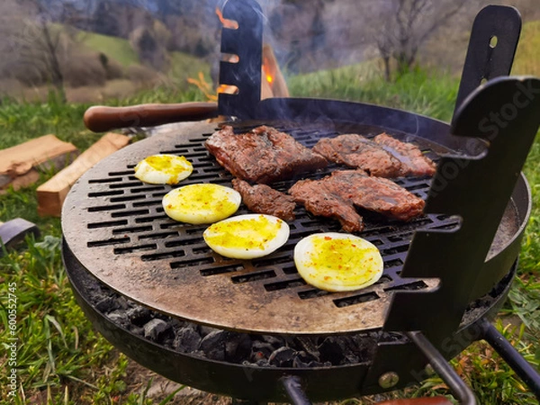 Obraz Beef steak on the grill with smoke and flames