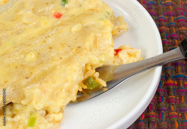 Fototapeta Close view of cooked chicken enchiladas with fork