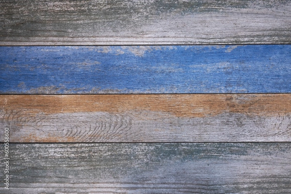 Fototapeta old wooden boards with bright blue and beige paint. horizontal lines. rough surface texture