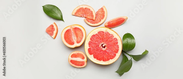 Obraz Ripe cut grapefruit on light background, top view