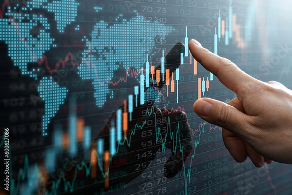 Fototapeta Graphs and world financial markets data. Investor pointing at the candlestick chart.