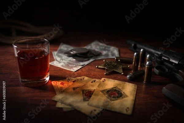 Obraz Poker at the Old Western Saloon Table with playing cards, whiskey and weapons