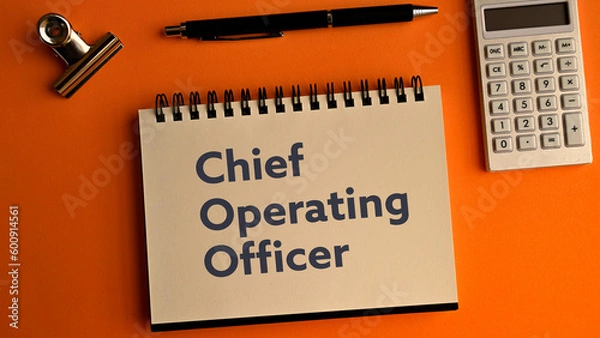 Fototapeta There is notebook with the word Chief Operating Officer. It is as an eye-catching image.