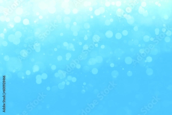 Fototapeta Refreshing defocused background with beautiful round lights scattered on a light blue base