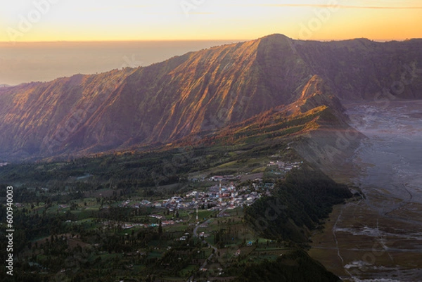 Obraz Small town on the hill with sunlight.