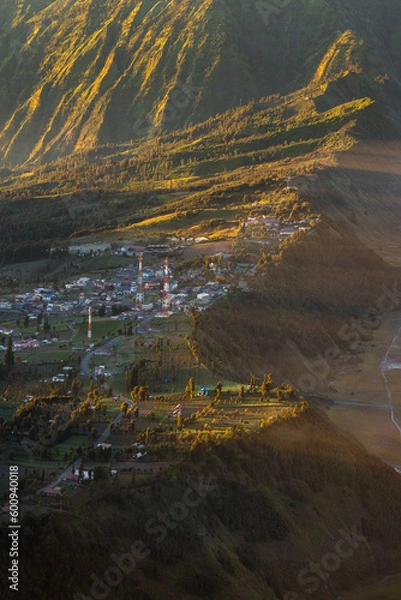 Obraz Small town on the hill with sunlight.