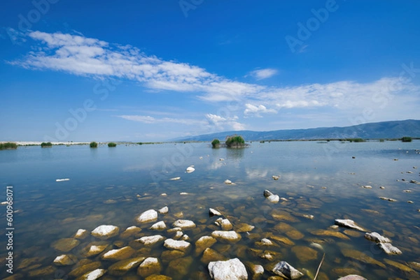 Obraz Lake Karla, calm and beautiful lake, Greece, a unique wetland, with water changes, small islands and aquatic plants and birds.