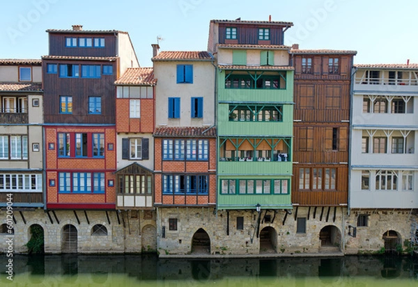 Obraz Charming houses line the river Agout in Castres, France, showcasing stunning architecture and beautiful reflections in the water. A picturesque and peaceful scene to admire.