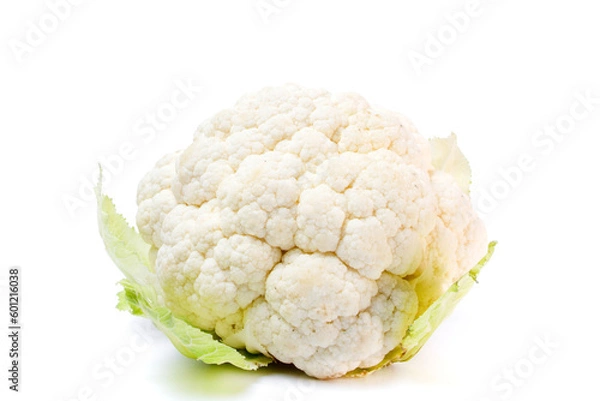 Fototapeta Whole head of fresh white raw cauliflower with leaves close-up on white background. Isolated on white background