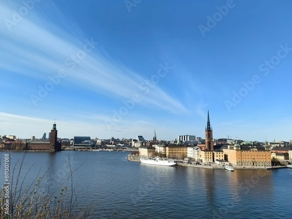 Obraz Panoramic view of Gamla Stan - the old town of Stockholm against the backdrop of water and blue sky.