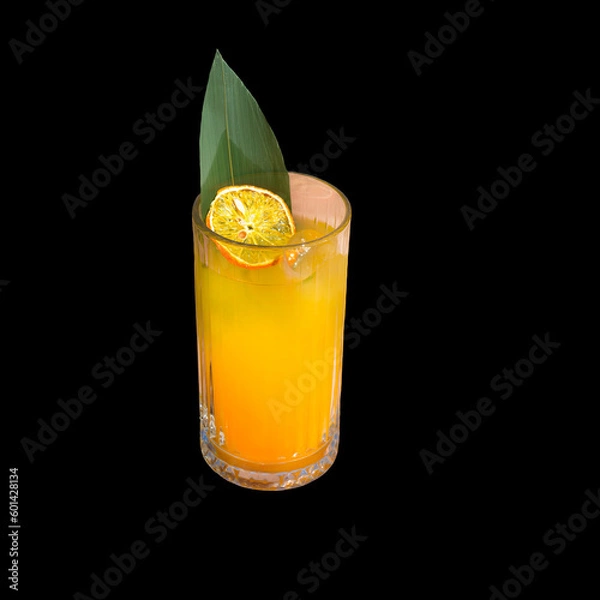 Fototapeta Glass with fruit juice. Exotic lemonade with orange chips slice and green leaf. Isolate.