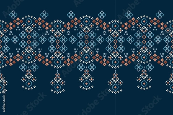 Fototapeta Ethnic geometric fabric pattern Cross Stitch.Ikat embroidery Ethnic oriental Pixel pattern navy blue background. Abstract,vector,illustration. Texture,clothing,scarf,decoration,carpet,silk wallpaper.