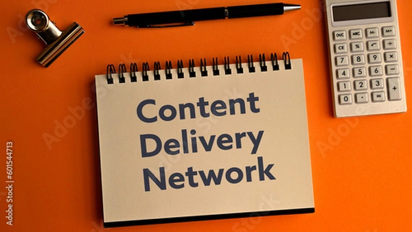 Fototapeta There is notebook with the word Content Delivery Network.It is as an eye-catching image.