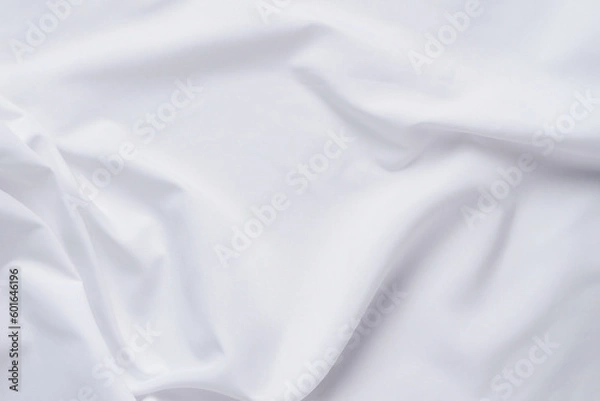 Fototapeta White fabric. luxurious white fabric texture background. Creases of satin, silk and cotton.