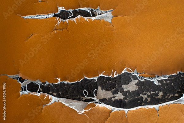 Obraz Tear damaged old synthetic leather brown sofa. Old cracked damaged leather on sofa synthetic leather upholstery.