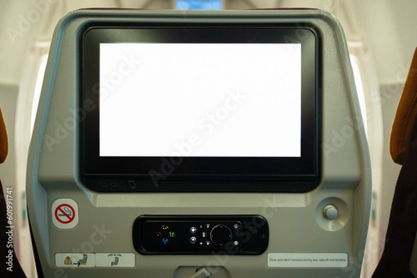 Fototapeta Close-up of an airplane seat with a white screen in the cabin