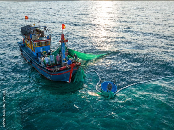 Obraz Fishing trawlers are fishing in the sea by huge net in Phu Yen, Vietnam