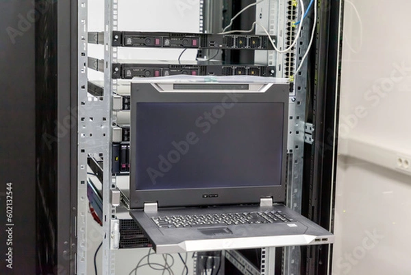 Fototapeta Datacenter server console. Information display in Datacenter server room. Installation of server hardware in the network computer rack and monitor of hardware's work.