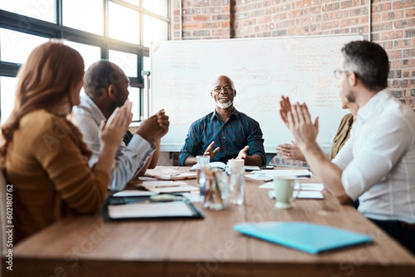 Obraz Business people, meeting and applause of black man in office for achievement, goal or target. Excited, clapping and senior African male professional with group of employees in celebration of success.