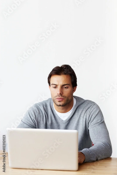 Fototapeta Laptop, research and business man isolated on white background for startup, career planning or web design ideas. Creative, focus and serious person or online user on computer at desk in studio mockup
