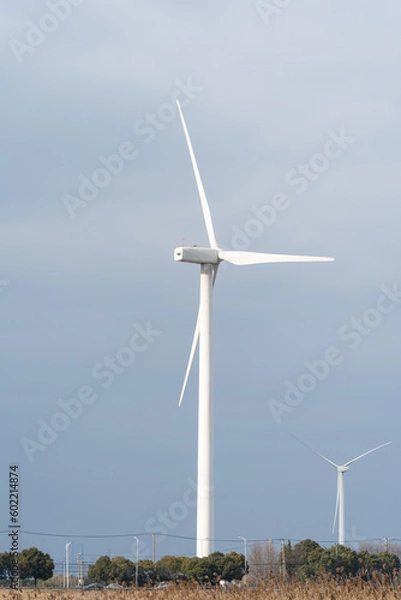Fototapeta Wind turbines in the suburbs