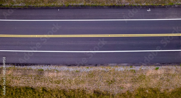Fototapeta Aerial view of the road in the city of Cananéia. Highway in Pariquera Açu