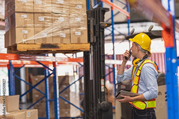 Fototapeta Factory Warehouse Worker Working Operate Loading Cargo In Shipping Area Inventory Control Foreman.