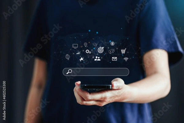 Fototapeta Businessman using a Smathphone for analysis SEO Search Engine Optimization Marketing Ranking Traffic Website Internet Business Technology Concept.