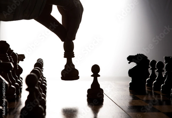 Obraz man makes a move chess figure