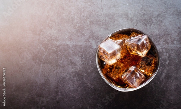 Obraz Top view refreshing cola with ice cubes on gray background