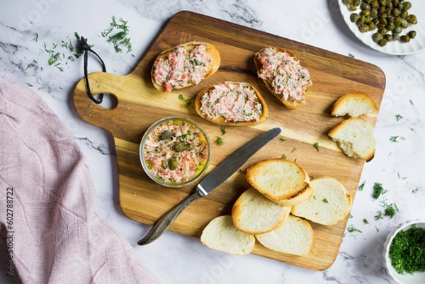Obraz Salmon rillettes, mousse, pate and toasts on wooden background