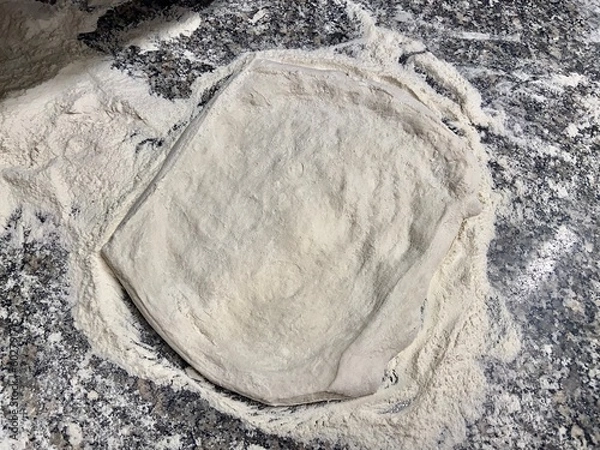 Obraz Flat and neutral pizza base. Artisan flour and bakery. Raw white pizza on marble counter. Neutral background image.