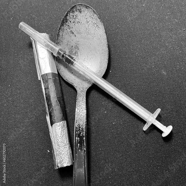 Obraz Tools for heroin and drug use. Spoon, syringe and blowtorch for smoking narcotic substances. Items for cocaine consumption. Image with neutral background.