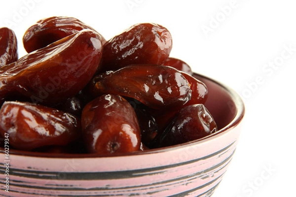 Fototapeta Dried dates in bowl isolated on white