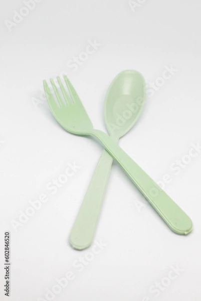 Fototapeta isolated photo of sage color plastic cutlery and chopsticks on a white background