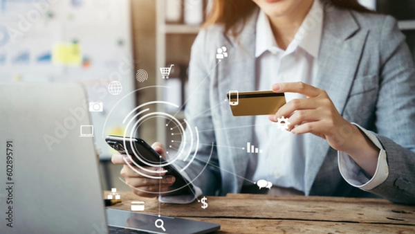 Fototapeta Closeup woman holding hand smartphone. Businessman use credit card online payments shopping touching screen mobile phone name numbers.