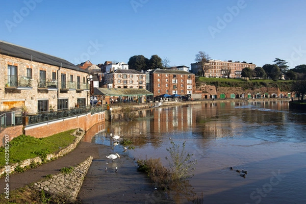 Fototapeta Skyline of the historic quayside of Exeter in Devon at sunrise, UK