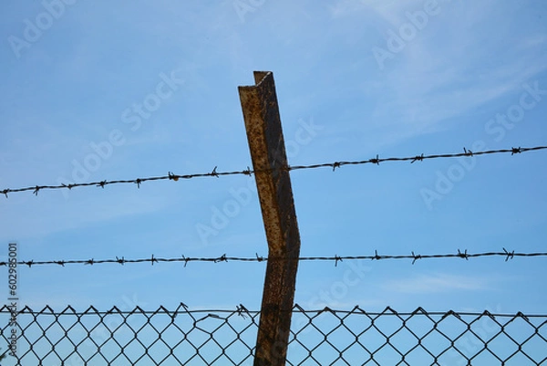 Obraz rusty barbed wire fence