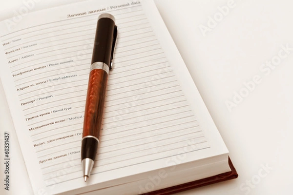 Fototapeta Книга для записи личных данных и ручка
