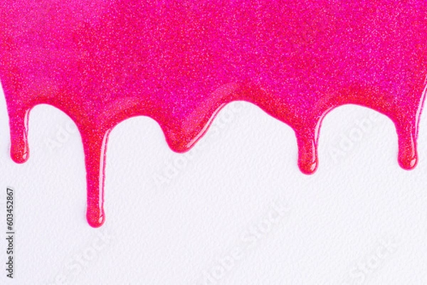 Obraz Pink glitter sparkle confetti background liquid drops of paint color flow down on white canvas. Dark pink glitter paint dripping on the white wall