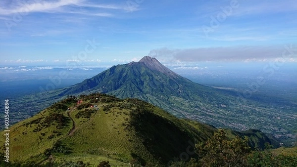 Fototapeta view of active Merapi volcano from the top of mount Merbabu