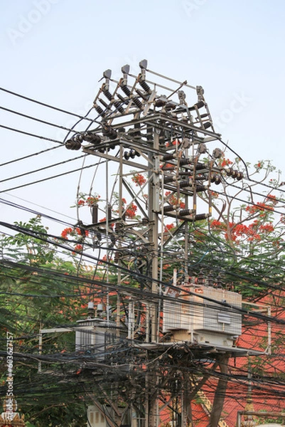 Obraz Messy and dangerous electricity power cables hanging in Vientiane streets, Laos.