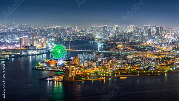 Fototapeta Aerial view of city with bright light on port of Kobe at night.